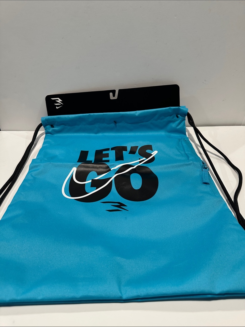 NWT Let’s Go Nike Swoosh Pullstring Bag with Zipper Side pocket.